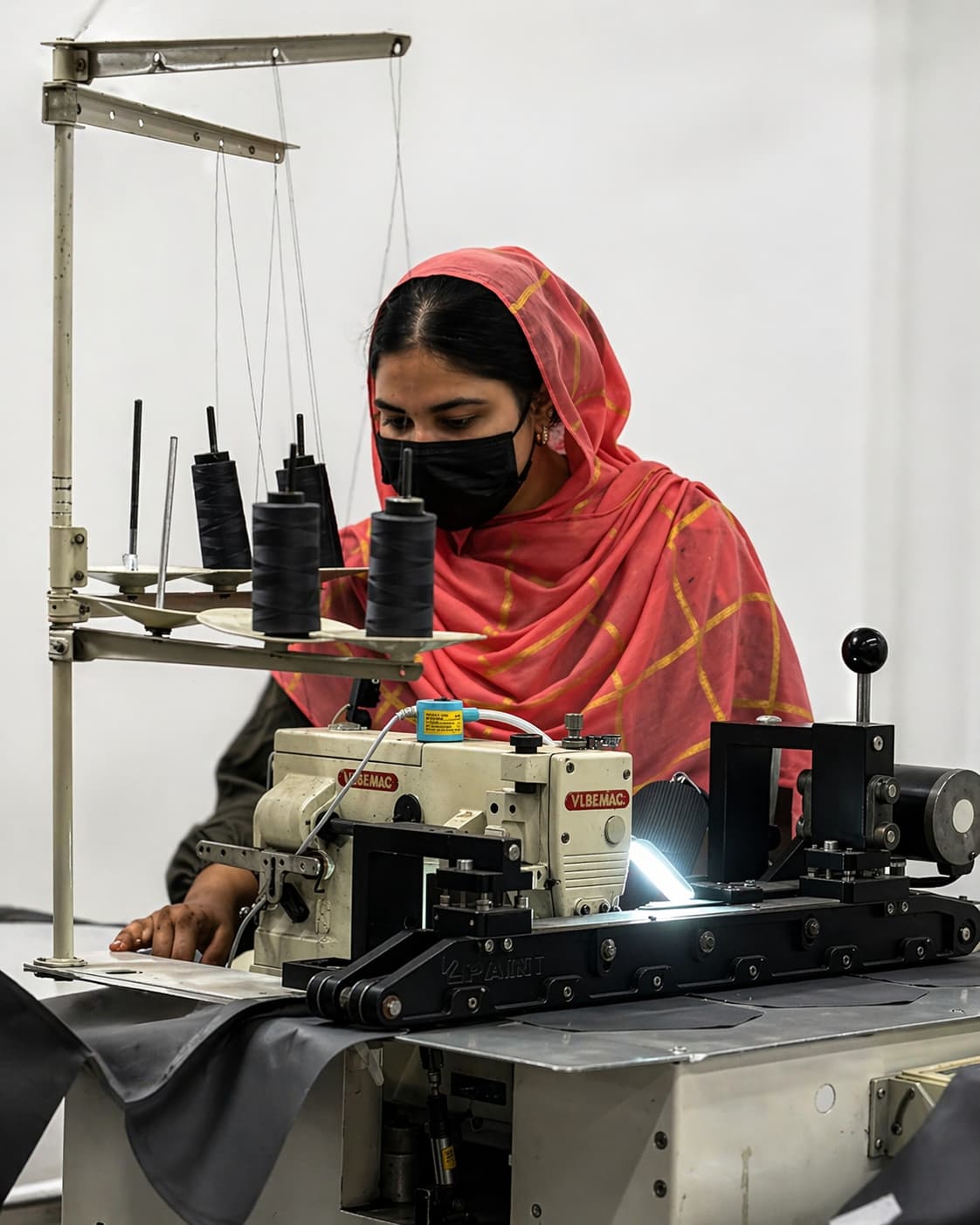 Workers operating sewing machines